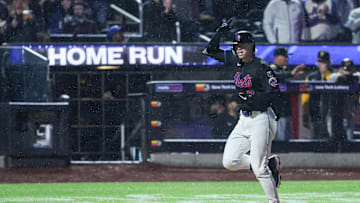 May 13, 2025; New York City, New York, USA; New York Mets second baseman Brett Baty (7) hits a solo home run in the seventh inning against the Pittsburgh Pirates at Citi Field. Mandatory Credit: Wendell Cruz-Imagn Images