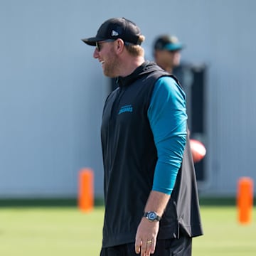 Jacksonville Jaguars wide receiver Travis Hunter (12) has a laugh with Jacksonville Jaguars head coach Liam Coen during the Jacksonville Jaguars’ third mandatory minicamp Thursday June 12, 2025 at the Miller Electric Center in Jacksonville, Fla. [Doug Engle/Florida Times-Union]