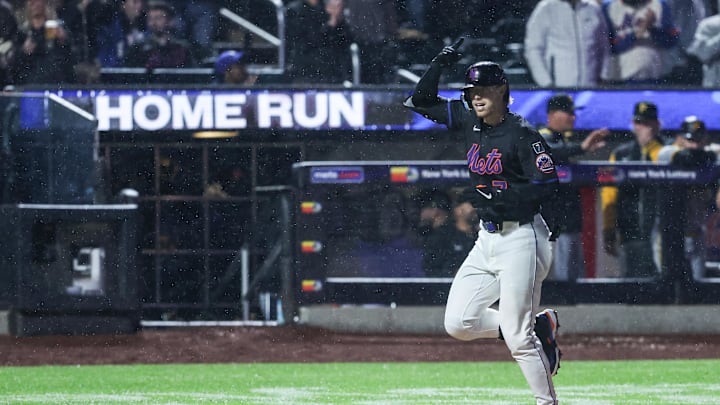 May 13, 2025; New York City, New York, USA; New York Mets second baseman Brett Baty (7) hits a solo home run in the seventh inning against the Pittsburgh Pirates at Citi Field. Mandatory Credit: Wendell Cruz-Imagn Images