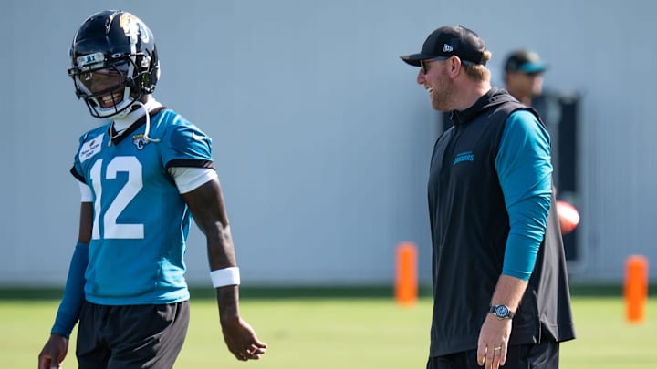 Jacksonville Jaguars wide receiver Travis Hunter (12) has a laugh with Jacksonville Jaguars head coach Liam Coen during the Jacksonville Jaguars’ third mandatory minicamp Thursday June 12, 2025 at the Miller Electric Center in Jacksonville, Fla. [Doug Engle/Florida Times-Union]