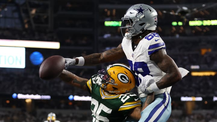 Jan 14, 2024; Arlington, Texas, USA; Green Bay Packers cornerback Keisean Nixon (25) breaks up a pass for Dallas Cowboys wide receiver CeeDee Lamb (88) during the second half of the 2024 NFC wild card game at AT&T Stadium.