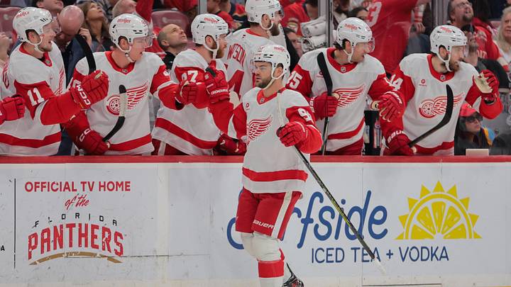 Apr 10, 2025; Sunrise, Florida, USA; Detroit Red Wings right wing Alex DeBrincat (93) celebrates with teammates after scoring against the Florida Panthers during the first period at Amerant Bank Arena. Mandatory Credit: Sam Navarro-Imagn Images