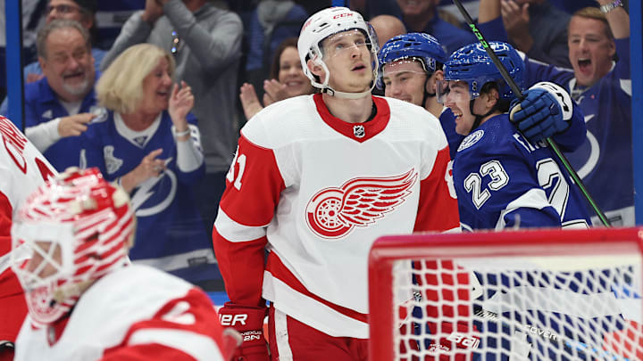 Apr 13, 2023; Tampa, Florida, USA; Tampa Bay Lightning center Michael Eyssimont (23) is congratulated by center Ross Colton (79) after he scored a goal as Detroit Red Wings left wing Dominik Kubalik (81) looks on during the third period at Amalie Arena. Mandatory Credit: Kim Klement-Imagn Images