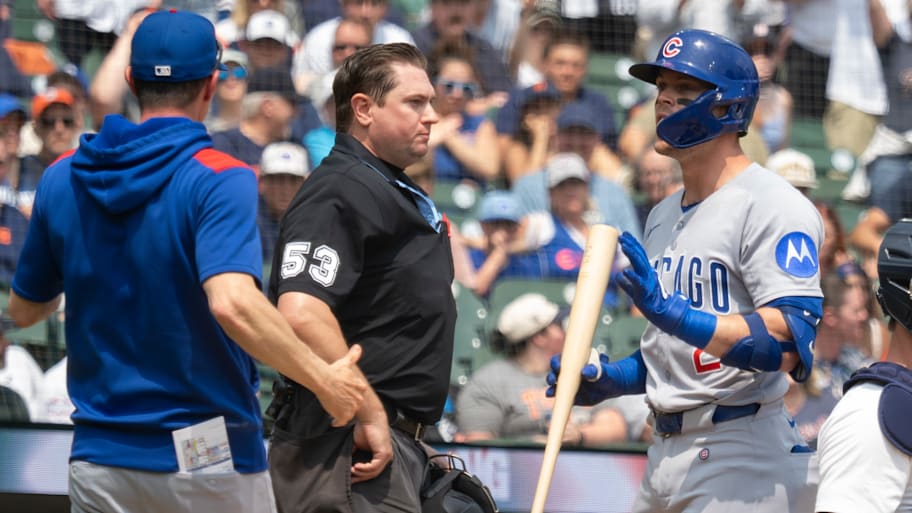 Chicago Cubs infelder Nico Hoerner argues with home plate umpire Derek Thomas after a called third strike.  | Joseph Weiser/Icon Sportswire via Getty Images