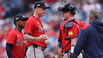 May 29, 2025; Philadelphia, Pennsylvania, USA; Atlanta Braves pitcher AJ Smith-Shawver (32) talks with catcher Sean Murphy (12) before leaving the game during the third inning against the Philadelphia Phillies at Citizens Bank Park. Mandatory Credit: Bill Streicher-Imagn Images