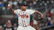 Sep 23, 2025; Cumberland, Georgia, USA; Atlanta Braves relief pitcher Raisel Iglesias (26)  pitches against the Washington Nationals during the ninth inning at Truist Park. Mandatory Credit: Dale Zanine-Imagn Images