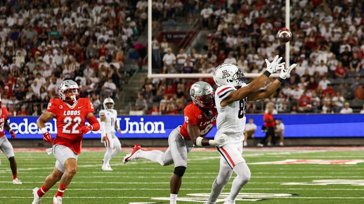 Aug 31, 2024; Tucson, Arizona, USA; New Mexico Lobos safety Christian Ellis (8) goes in to tackle Arizona Wildcats tightend Keyan Burnett (88) while he catches the ball during first quarter at Arizona Stadium. Mandatory Credit: Aryanna Frank-Imagn Images