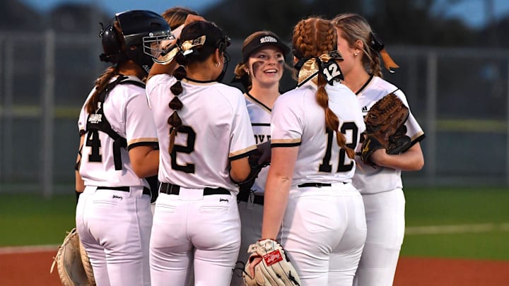 Rider huddles up at the mound during a game against Aledo on Tuesday, March 5, 2024 at Sunrise Softball Field.
