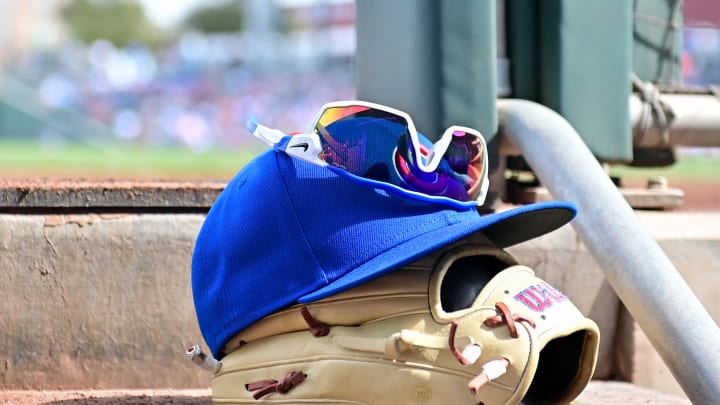 Feb 27, 2024; Mesa, Arizona, USA;  General view of a Chicago Cubs glove, hat and glasses in the