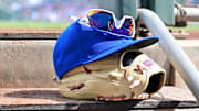 Feb 27, 2024; Mesa, Arizona, USA;  General view of a Chicago Cubs glove, hat and glasses in the first inning against the Cincinnati Reds during a spring training game at Sloan Park. Mandatory Credit: Matt Kartozian-Imagn Images