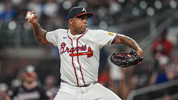 Sep 23, 2025; Cumberland, Georgia, USA; Atlanta Braves relief pitcher Raisel Iglesias (26)  pitches against the Washington Nationals during the ninth inning at Truist Park. Mandatory Credit: Dale Zanine-Imagn Images