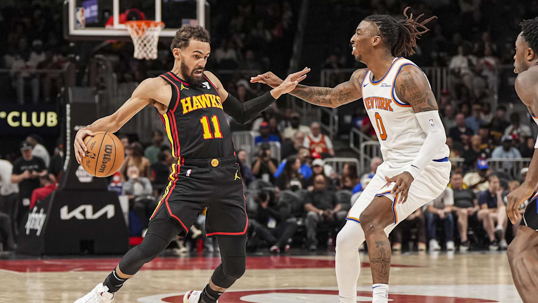 Apr 5, 2025; Atlanta, Georgia, USA; Atlanta Hawks guard Trae Young (11) tries to avoid the defense of New York Knicks guard Delon Wright (0) during the second half at State Farm Arena. Mandatory Credit: Dale Zanine-Imagn Images Apr 5, 2025; Atlanta, Georgia, USA; Atlanta Hawks guard Trae Young (11) tries to avoid the defense of New York Knicks guard Delon Wright (0) during the second half at State Farm Arena. Mandatory Credit: Dale Zanine-Imagn Images