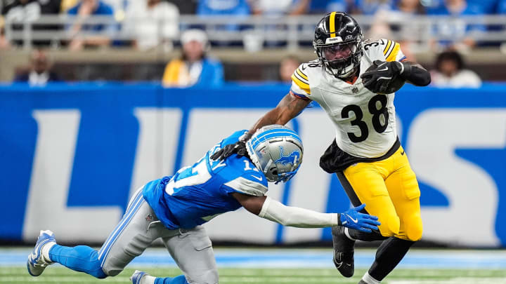 Detroit Lions cornerback Essang Bassey (17) tackles Pittsburgh Steelers running back La'Mical Perine (38) during the first half of a preseason game at Ford Field in Detroit on Saturday, August 24, 2024.