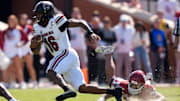 South Carolina Gamecocks quarterback LaNorris Sellers (16) runs past Oklahoma Sooners defensive lineman Trace Ford (30) during a college football game between the University of Oklahoma Sooners (OU) and the South Carolina Gamecocks at Gaylord Family - Oklahoma Memorial Stadium in Norman, Okla., Saturday, Oct. 19, 2024.