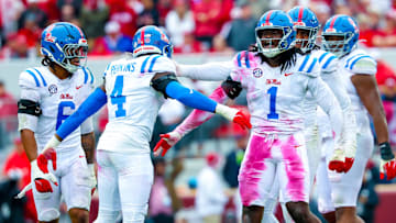 Ole Miss Rebels defender Suntarine Perkins (4) celebrates with teammates