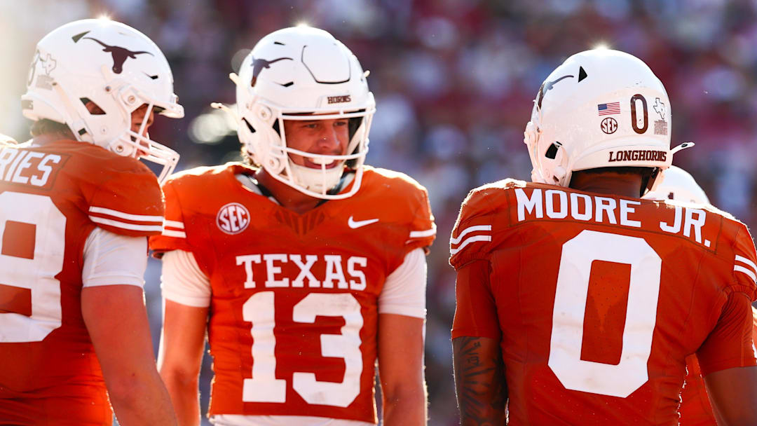 Oct 11, 2025; Dallas, Texas, USA;  Texas Longhorns wide receiver DeAndre Moore Jr. (0) celebrates with Texas Longhorns wide receiver Parker Livingstone (13)  after scoring a touchdown during the second half against the Oklahoma Sooners at the Cotton Bowl. Mandatory Credit: Kevin Jairaj-Imagn Images