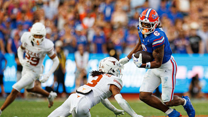 Oct 4, 2025; Gainesville, Florida, USA; Florida Gators wide receiver Dallas Wilson (6) breaks a tackle from Texas Longhorns defensive back Jaylon Guilbeau (3) during the second half at Ben Hill Griffin Stadium. Mandatory Credit: Matt Pendleton-Imagn Images