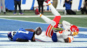 Sep 21, 2025; East Rutherford, New Jersey, USA; Kansas City Chiefs safety Bryan Cook (6) and New York Giants wide receiver Malik Nabers (1) react after a collision in the fourth quarter  at MetLife Stadium. Mandatory Credit: Robert Deutsch-Imagn Images