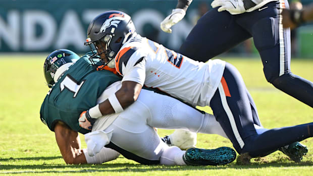 Denver Broncos cornerback Ja'Quan McMillian (29) sacks Philadelphia Eagles quarterback Jalen Hurts (1).