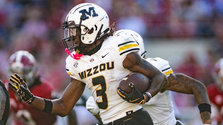 Luther Burden runs the ball against Alabama. Luther Burden runs the ball against Alabama.