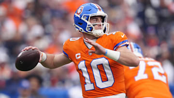 Oct 26, 2025; Denver, Colorado, USA; Denver Broncos quarterback Bo Nix (10) throws a pass against the Dallas Cowboys in the first quarter at Empower Field at Mile High. Mandatory Credit: Ron Chenoy-Imagn Images