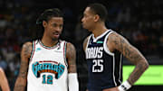 Apr 18, 2025; Memphis, Tennessee, USA; Memphis Grizzlies guard Ja Morant (12) and Dallas Mavericks forward P.J. Washington (25) look on during the fourth quarter at FedExForum. Mandatory Credit: Petre Thomas-Imagn Images