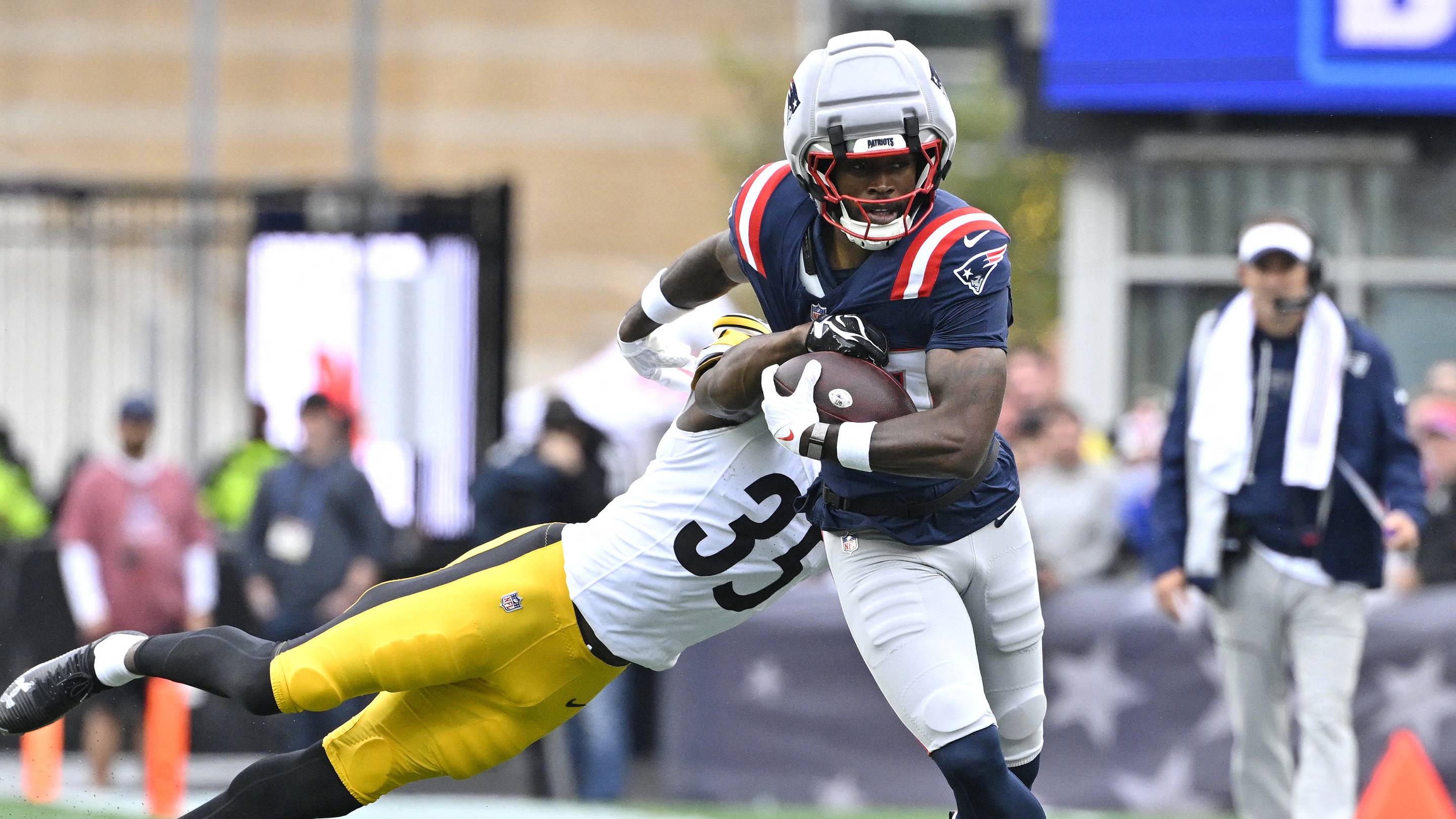 Sep 20, 2026; Foxborough, Massachusetts, USA; New England Patriots wide receiver Romeo Doubs (87) runs after a catch against Pittsburgh Steelers cornerback Jamel Dean (35) in the first half at Gillette Stadium. Mandatory Credit: Eric Canha-Imagn Images