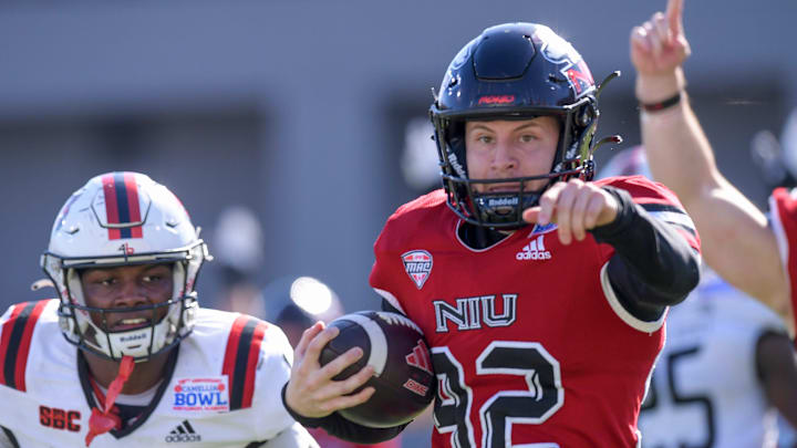 Northern Illinois Huskies kicker Kanon Woodill (92) carrins the ball in for a touchdown on a fake field goal against the Arkansas State Red Wolves in first half action in the Camellia Bowl at Cramton Bowl in Montgomery, Ala., on Saturday December 23, 2023.