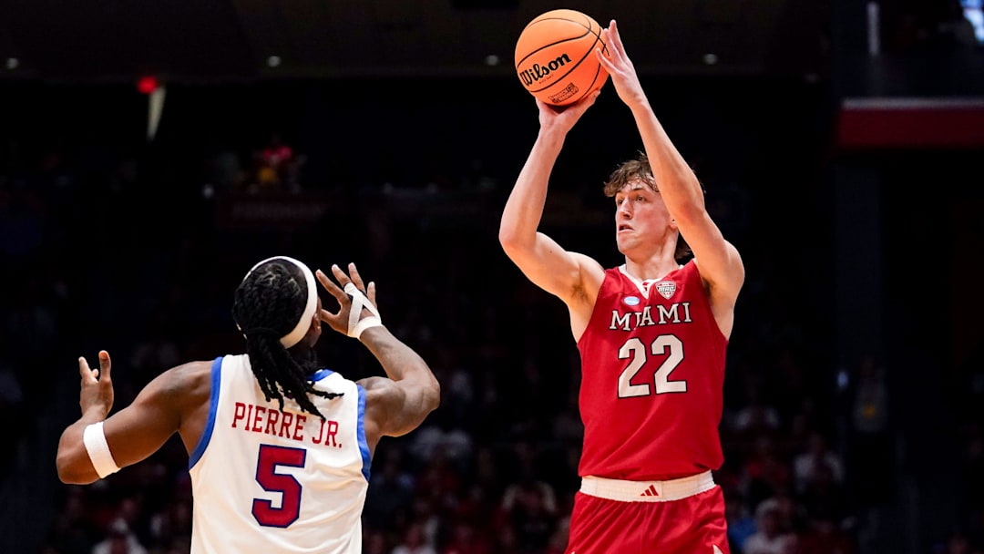 Miami (OH) RedHawks wing Brant Byers (22) shoots from three point range in the first half of the NCAA Tournament First Four game between the Miami Redhawks and Southern Methodist University Mustangs, Wednesday, March 18, 2026, at University of Dayton Arena in Dayton, Oh.