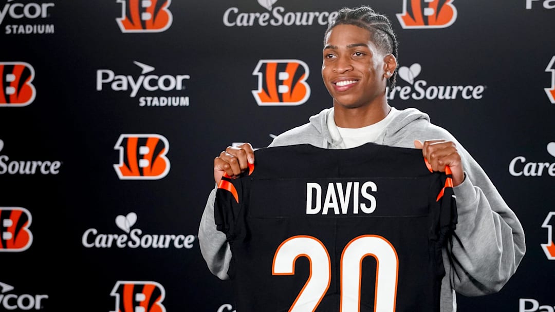 Cincinnati Bengals third round pick Tacario Davis holds his jersey at a press conference during the 2026 NFL Draft, Saturday, April 25, 2026, at Paycor Stadium in downtown Cincinnati.