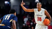 Cincinnati Bearcats forward Baba Miller (18) signals to a teammate in the first half of a NCAA men’s basketball game between the Cincinnati Bearcats and Mount St. Mary’s Mountaineers, Sunday, Nov. 16, 2025, at Fifth Third Arena in Cincinnati.
