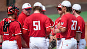 NC State Wolfpack players meet on the mound during an eventful first inning against the Stetson Hatters during the NCAA Baseball Regional Tournament at Plainsman Park in Auburn, Ala., on Friday May 30, 2025.