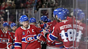 Apr 8, 2025; Montreal, Quebec, CAN; Montreal Canadiens forward Nick Suzuki (14) celebrates with teammates after scoring a goal against the Detroit Red Wings during the third period at the Bell Centre. Mandatory Credit: Eric Bolte-Imagn Images