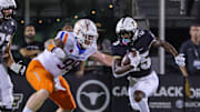 Sep 2, 2021; Orlando, Florida, USA; UCF Knights running back Johnny Richardson (25) runs the ball as Boise State Broncos defensive tackle Scott Matlock (99) moves in during the first quarter at Bounce House. Mandatory Credit: Mike Watters-Imagn Images