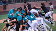 Coastal Carolina players dogpile after eliminating Auburn in the NCAA Baseball Super Regonal at Plainsman Park in Auburn, Ala., on Friday June 6, 2025.