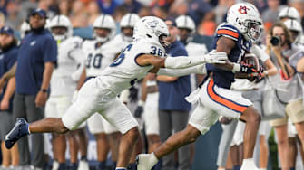 Auburn Tigers wide receiver Jay Fair (5) is stopped afewter a big gain by Samford Bulldogs defensive back Dontae Pollard (36) during first half action in the AU vs. Samford game at Jordan-Hare Stadium in the AU campus in Auburn, Ala., on Saturday September 16, 2023.