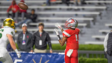 Saraland's Ryan Williams catches a touchdown pass in first half action against Mountain Brook during