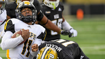 Alabama State defensive back Adrian Maddox (14) wraps up Arkansas-Pine Bluff   s Skyler Perry (11) during the Turkey Day Classic in Montgomery, Ala., on Thursday November 24, 2022.

Tdc28