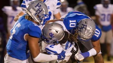 Highland Home's Keldric Faulk (15) and CJ May (10) stop Clarke County's Andre Ezell (2) during their playoff game on the Highland Home campus in Highland Home, Ala. on Friday evening November 18, 2022.

Hh12