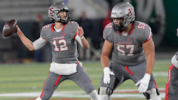 Thompson's Trent Seaborn (12) passes against Central Phenix City during the AHSAA 7A football state championship in Birmingham, Ala., on Wednesday December 3, 2024.