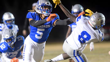 Highland Home's Jakaleb Faulk (5) blocks against Clarke County's Jarrad Robinson (8) during their
