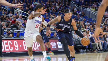 Dec 7, 2022; Orlando, Florida, USA; Orlando Magic forward Paolo Banchero (5) drives around LA