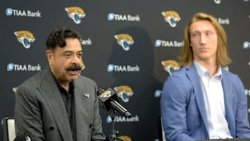 Jacksonville Jaguars owner Shad Khan takes questions from the media as his new first-round draft pick Trevor Lawrence looks on at a press conference on Friday, April 30, 2021, at TIAA Bank Field.
