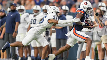 Auburn Tigers wide receiver Jay Fair (5) is stopped afewter a big gain by Samford Bulldogs defensive back Dontae Pollard (36) during first half action in the AU vs. Samford game at Jordan-Hare Stadium in the AU campus in Auburn, Ala., on Saturday September 16, 2023.