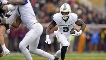 Oct 28, 2023; Minneapolis, Minnesota, USA; Michigan State Spartans running back Nate Carter (5) runs with the ball against the Minnesota Golden Gophers during the first quarter at Huntington Bank Stadium. Mandatory Credit: Nick Wosika-USA TODAY Sports