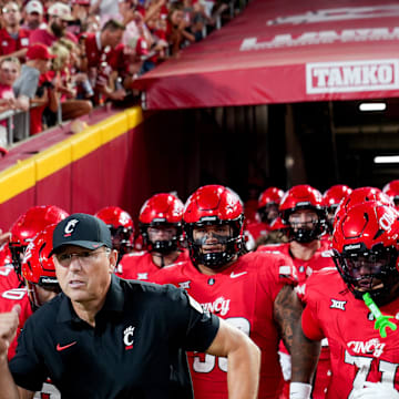 The Cincinnati Bearcats run out the tunnel to face off against the Nebraska Cornhuskers at the Kansas City Classic, Aug. 28, 2025, at Arrowhead Stadium in Kansas City, Mo.