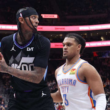 Utah Jazz guard Jordan Clarkson holds the ball away from Oklahoma City Thunder forward Dillon Jones. Mandatory Credit: Rob Gray-Imagn Images
