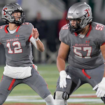 Thompson's Trent Seaborn (12) passes against Central Phenix City during the AHSAA 7A football state championship in Birmingham, Ala., on Wednesday December 3, 2024.