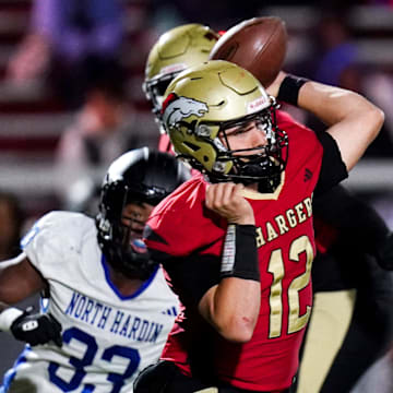 Bullitt East Charger throws a pass in the second half of a high school football game between the Bullitt East Chargers and North Hardin Trojans, Thursday, Nov. 6, 2025, at Bullitt East High School Stadium. Chargers won 28-21.