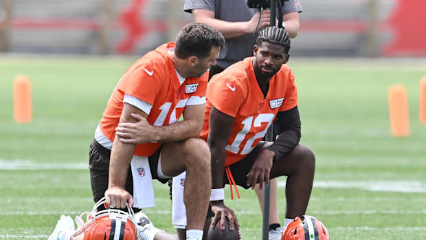 Jun 10, 2025; Berea, OH, USA; Cleveland Browns quarterback Joe Flacco (15) talks to quarterback Shedeur Sanders (12) during m